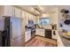 Efficient kitchen with white cabinets, stainless steel appliances, and granite countertops at 5757 S Algonquian Way # E, Aurora, CO 80016