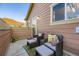 Inviting outdoor patio with comfortable seating and colorful cushions, perfect for relaxing outside at 5757 S Algonquian Way # E, Aurora, CO 80016