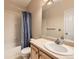 Neutral bathroom with tub and shower combination with lovely vanity area at 10578 Parkington Ln # 35D, Highlands Ranch, CO 80126