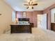 View of primary bedroom including an en suite bathroom and walk-in closet at 10578 Parkington Ln # 35D, Highlands Ranch, CO 80126