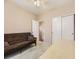 Bedroom with plush carpet, large closet, and futon for relaxing or sleeping at 10578 Parkington Ln # 35D, Highlands Ranch, CO 80126