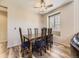 Elegant dining room showcases chandelier, wood floors, and natural light at 10578 Parkington Ln # 35D, Highlands Ranch, CO 80126