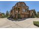Stylish multi-story townhome featuring a stone facade, attached garages and well maintained landscaping at 10578 Parkington Ln # 35D, Highlands Ranch, CO 80126
