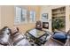 Inviting living room featuring a fireplace, comfortable seating, and natural light at 10578 Parkington Ln # 35D, Highlands Ranch, CO 80126