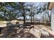 Patio area with stone tiles, mature trees, and a metal patio set at 820 W Mahogany Cir, Louisville, CO 80027