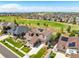 Aerial view of a house with solar panels, nestled in a community near a golf course at 7609 S Country Club Pkwy, Aurora, CO 80016