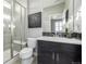 Modern bathroom with walk-in shower and stylish vanity at 7609 S Country Club Pkwy, Aurora, CO 80016