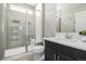 Modern bathroom with shower, toilet and vanity at 7609 S Country Club Pkwy, Aurora, CO 80016