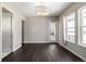 Bright dining room with dark hardwood floors and access to backyard patio at 7609 S Country Club Pkwy, Aurora, CO 80016