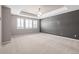 Large main bedroom with wall-to-wall carpeting and modern lighting fixture at 7609 S Country Club Pkwy, Aurora, CO 80016