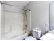 Cozy bathroom featuring a tiled shower over tub, toilet, and sink vanity at 8416 Pebble Creek Way # 203, Highlands Ranch, CO 80126