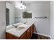 Bathroom featuring a double sink vanity and ample mirror space at 8416 Pebble Creek Way # 203, Highlands Ranch, CO 80126