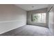 Bright bedroom features a large window allowing ample natural light at 8416 Pebble Creek Way # 203, Highlands Ranch, CO 80126