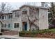 Charming two-story condo featuring a private porch, complemented by landscaped grounds and a well-maintained facade at 8416 Pebble Creek Way # 203, Highlands Ranch, CO 80126