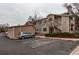 Condominium building showcases convenient parking and lovely landscaping at 8416 Pebble Creek Way # 203, Highlands Ranch, CO 80126