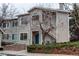 Inviting two-story home with a blue front door and a well-kept exterior at 8416 Pebble Creek Way # 203, Highlands Ranch, CO 80126