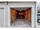 Garage interior with storage and wooden paneling for a functional storage space at 8416 Pebble Creek Way # 203, Highlands Ranch, CO 80126