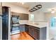 Contemporary kitchen with gray cabinets and modern appliances at 8416 Pebble Creek Way # 203, Highlands Ranch, CO 80126