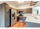 Modern kitchen featuring stainless steel appliances and a sink at 8416 Pebble Creek Way # 203, Highlands Ranch, CO 80126