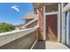 Balcony with brick accent overlooking the neighborhood street at 14251 E 1St Dr # 305, Aurora, CO 80011