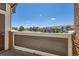Enjoy community views from this balcony with brown, white, and brick accents, perfect for relaxing outdoors at 14251 E 1St Dr # 305, Aurora, CO 80011