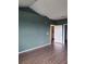 A spacious bedroom features hardwood floors, a fresh coat of paint, and easy access to laundry room and closet at 14251 E 1St Dr # 305, Aurora, CO 80011