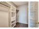 Walk-in closet with adjustable shelving units for optimal storage solutions at 14251 E 1St Dr # 305, Aurora, CO 80011