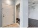 Welcoming entryway with tiled floors, coat rack nook and a view into the dining area at 14251 E 1St Dr # 305, Aurora, CO 80011