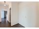 Hallway featuring wood floors, neutral walls, and archway leading to other rooms at 14251 E 1St Dr # 305, Aurora, CO 80011