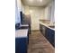 Bright kitchen featuring two toned cabinets, stainless steel appliances and wood floors at 14251 E 1St Dr # 305, Aurora, CO 80011