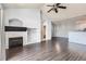 Spacious living room featuring a fireplace, hardwood floors, and an open layout at 14251 E 1St Dr # 305, Aurora, CO 80011