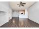 Bright living room boasts dark wood floors and an open floor plan to the kitchen, perfect for entertaining at 14251 E 1St Dr # 305, Aurora, CO 80011