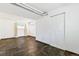 Finished basement area with tile flooring, a window, and a utility door at 8539 W Duquesne Dr, Lakewood, CO 80227