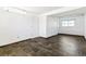 Finished basement area with tile flooring and two doors at 8539 W Duquesne Dr, Lakewood, CO 80227