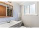 Bathroom vanity featuring a large mirror at 8539 W Duquesne Dr, Lakewood, CO 80227