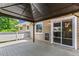 Outdoor deck with a gazebo, string lights, a sliding glass door, and a backyard view at 8539 W Duquesne Dr, Lakewood, CO 80227