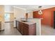Updated kitchen features granite counters and stone backsplash at 8539 W Duquesne Dr, Lakewood, CO 80227
