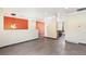 Open living area with modern tile floors, neutral walls, and bright lighting creating an inviting space at 8539 W Duquesne Dr, Lakewood, CO 80227