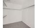 Walk-in closet with carpet, white walls and closet system with racks and shelves at 10968 Snowdon St, Parker, CO 80134
