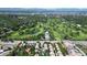 Aerial view showcasing lush golf course and surrounding neighborhood, blending recreation and residential living at 106 S University Blvd # 5, Denver, CO 80209