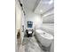 Elegant bathroom featuring a freestanding soaking tub and a barn door at 106 S University Blvd # 5, Denver, CO 80209