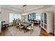 Inviting dining area filled with natural light and an open view of the living room at 106 S University Blvd # 5, Denver, CO 80209