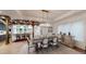 Elegant dining room with rustic table, chairs, and view into the kitchen at 106 S University Blvd # 5, Denver, CO 80209