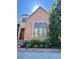 Brick home with a classic design, landscaping and a welcoming entrance at 106 S University Blvd # 5, Denver, CO 80209