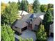 Brick home with a three car garage surrounded by mature trees at 106 S University Blvd # 5, Denver, CO 80209