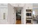 Pantry featuring custom cabinets and stainless steel appliances at 106 S University Blvd # 5, Denver, CO 80209