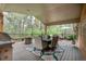 Enjoy the back deck with its grill, seating, fireplace, and table with chairs, perfect for gatherings at 7597 Molas Ct, Larkspur, CO 80118