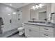 This bathroom features a modern vanity and a sleek glass shower at 7597 Molas Ct, Larkspur, CO 80118