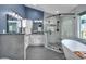 This bathroom features dual sinks and a modern glass shower at 7597 Molas Ct, Larkspur, CO 80118