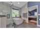 This bathroom features a modern tub, shower and tile at 7597 Molas Ct, Larkspur, CO 80118